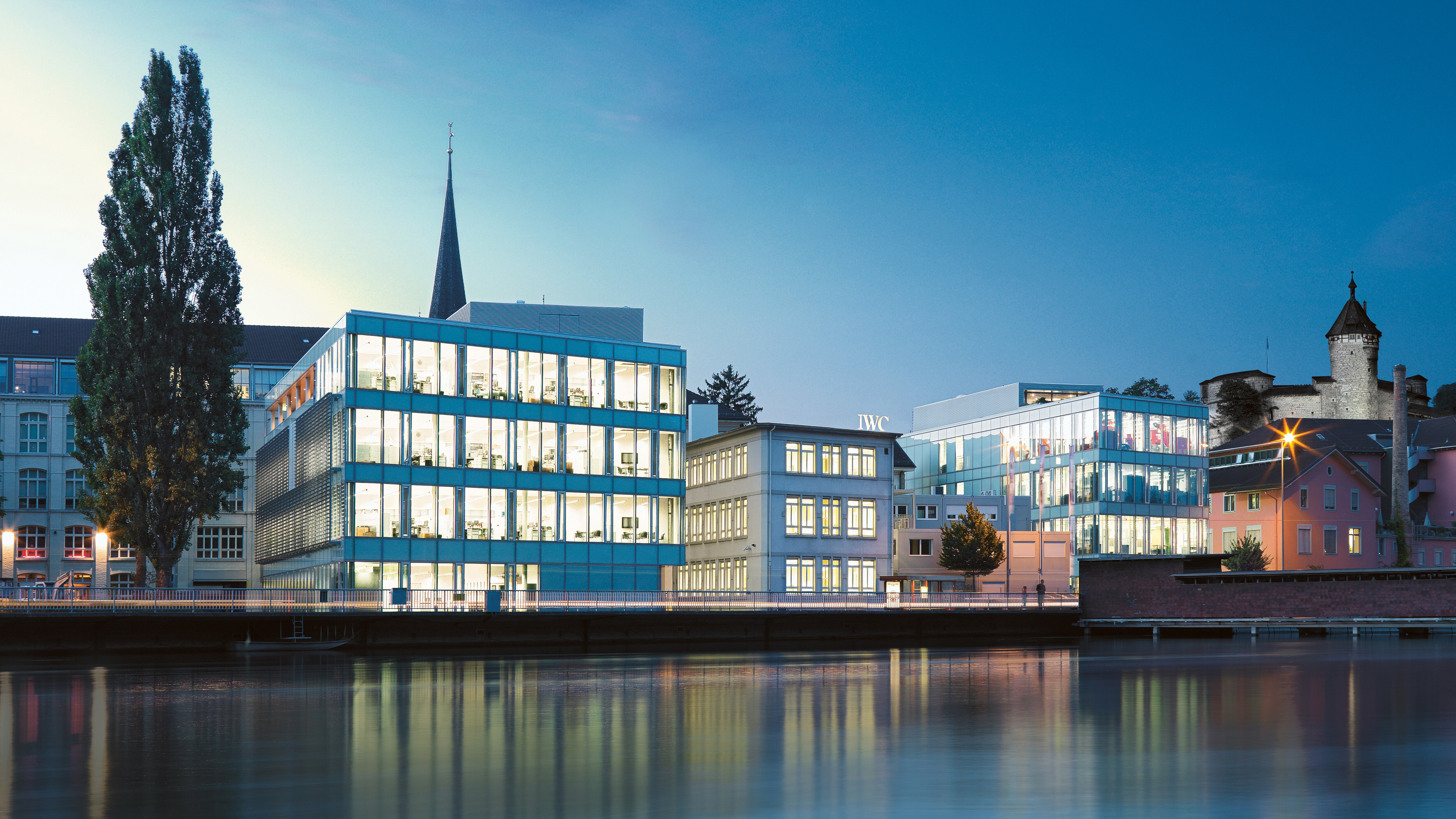 IWC Schaffhausen building by the water at night